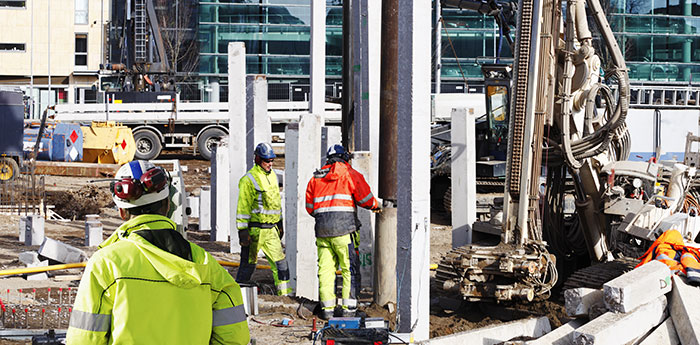 Non-Negligent Liability Insurance: Three construction workers on a construcion site.