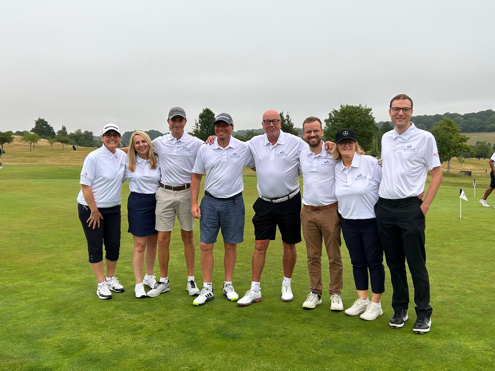 Daines Kapp team group photo on the green