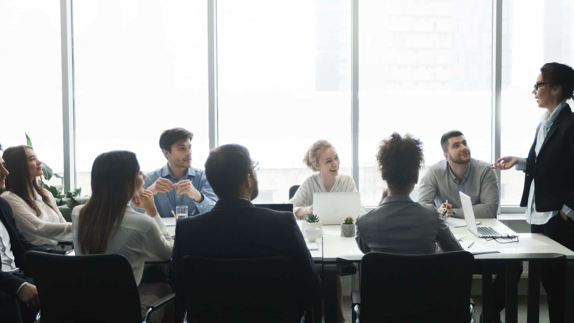 Diverse business team in a boardroom meeting — UK businesses need proactive cyber risk management as AI-driven threats increase